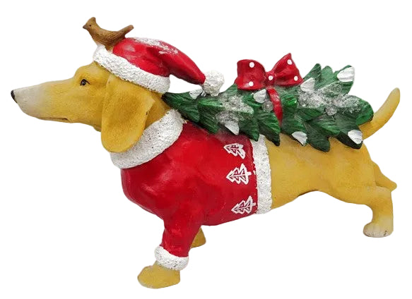 A figurine of a dog wearing a Santa Claus suit, carrying a Christmas tree with presents.