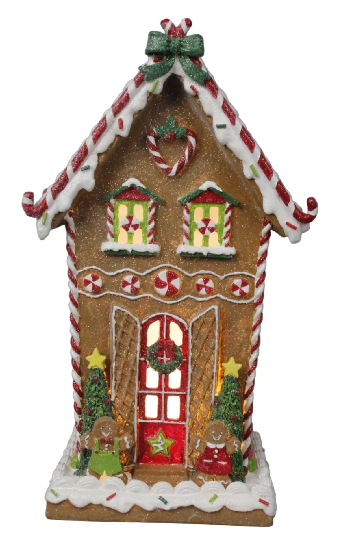 A decorative holiday ornament featuring a gingerbread house with a red door, white snow on the roof, and Christmas-themed decor.