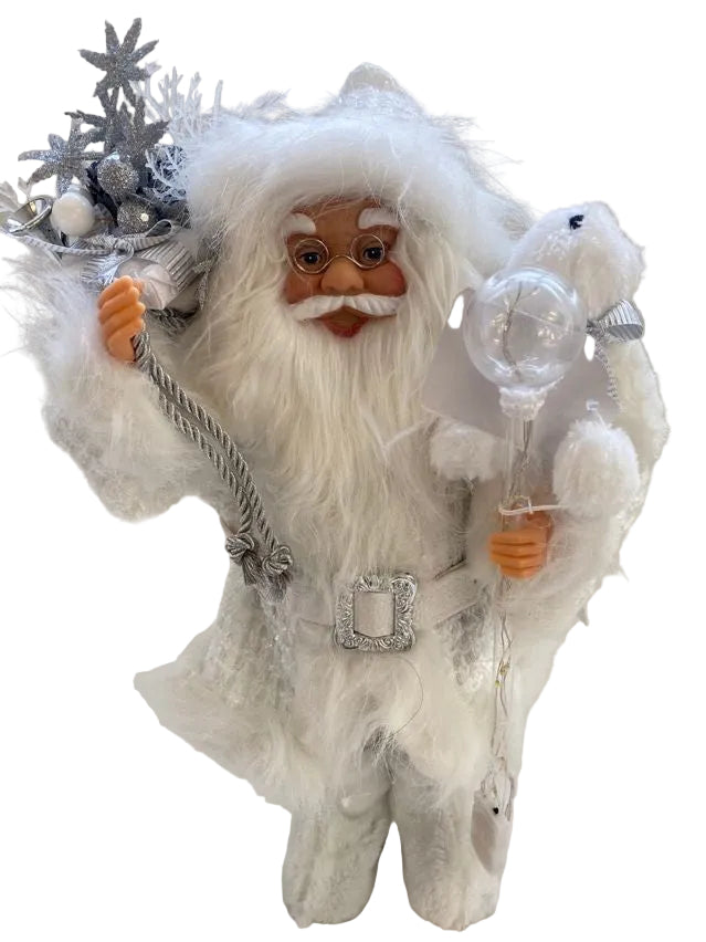 A white Santa Claus figurine with a fluffy white beard and hat, holding a Christmas sack and a clear glass light ornament