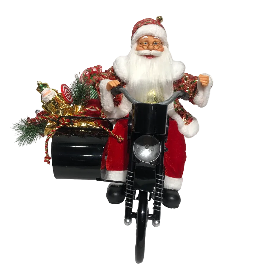 A figurine of Santa Claus sitting on a motorbike with Christmas decorations, including lights and a gift bag, intended as a holiday decoration.