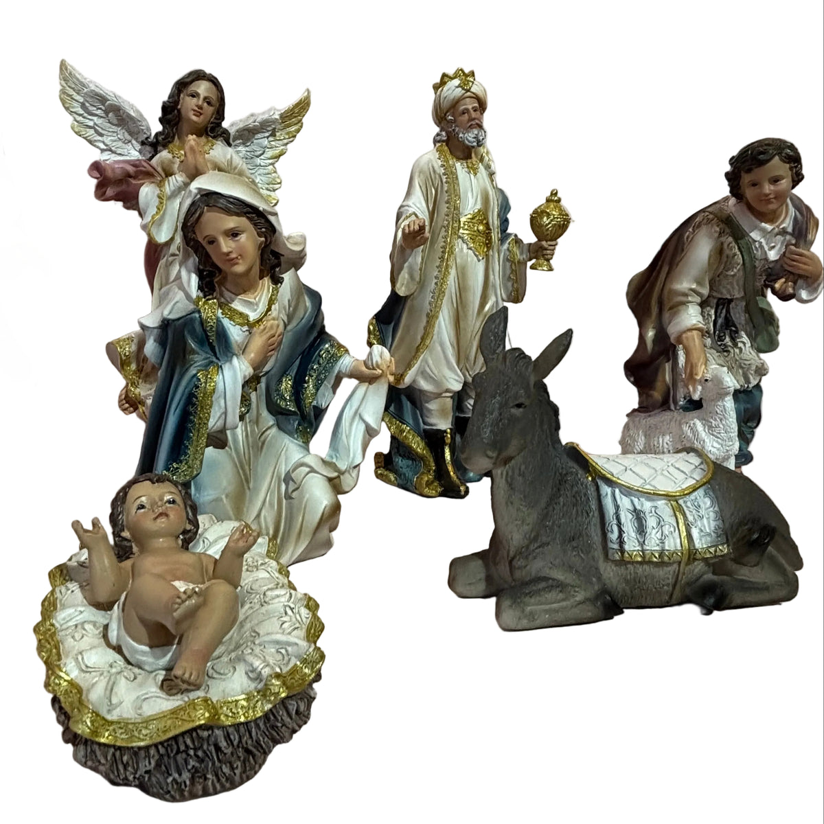 A set of traditional Christmas nativity figurines. The set includes the baby Jesus in a manger, Mary and Joseph, an angel, three wise men, and a donkey.