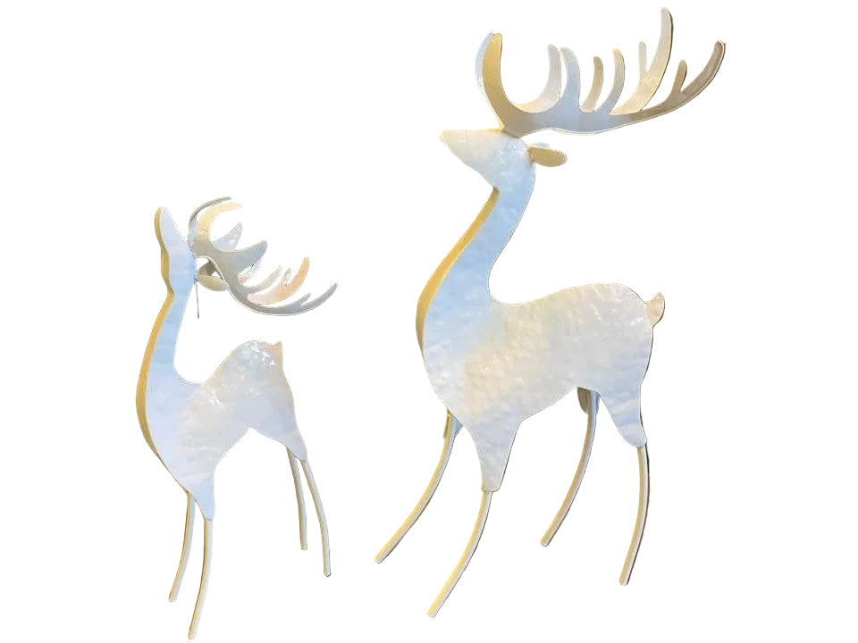 Two decorative metal deer figurines, one larger than the other, with a white finish and detailed antlers.
