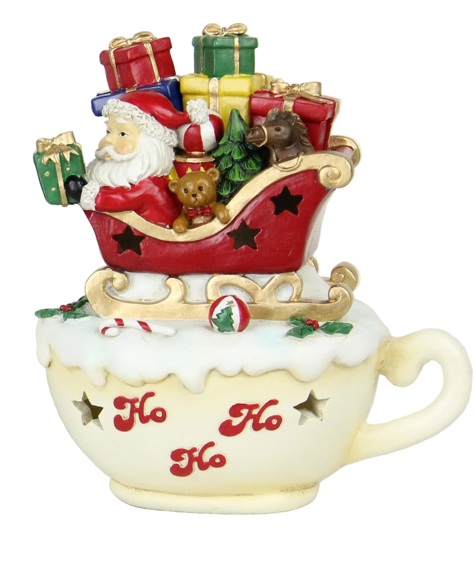 A decorative ceramic sleigh with Santa Claus and Christmas presents inside a white cup, featuring red, green, and gold colors.