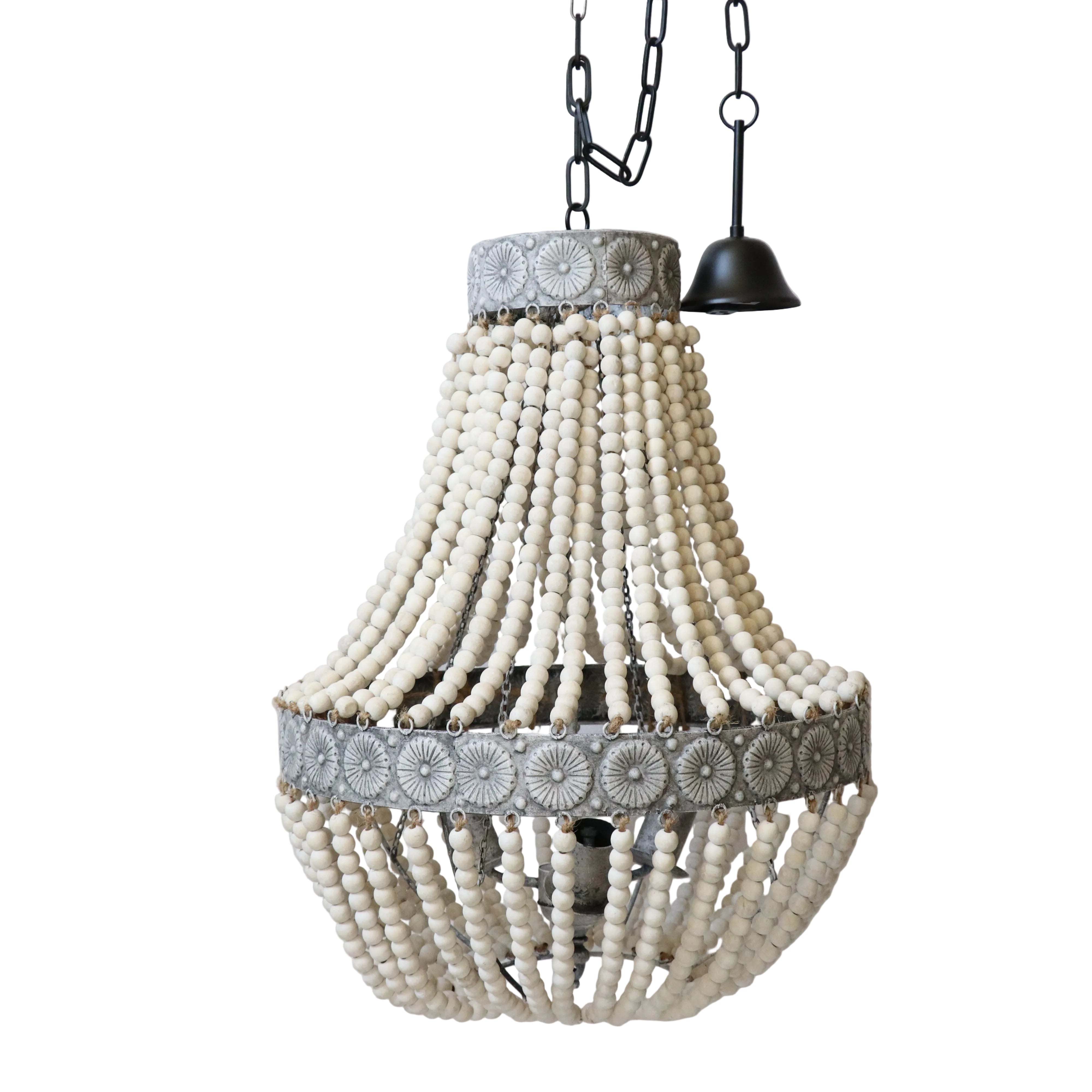 A beaded chandelier with a predominantly white and gray color scheme, hanging from black chains.