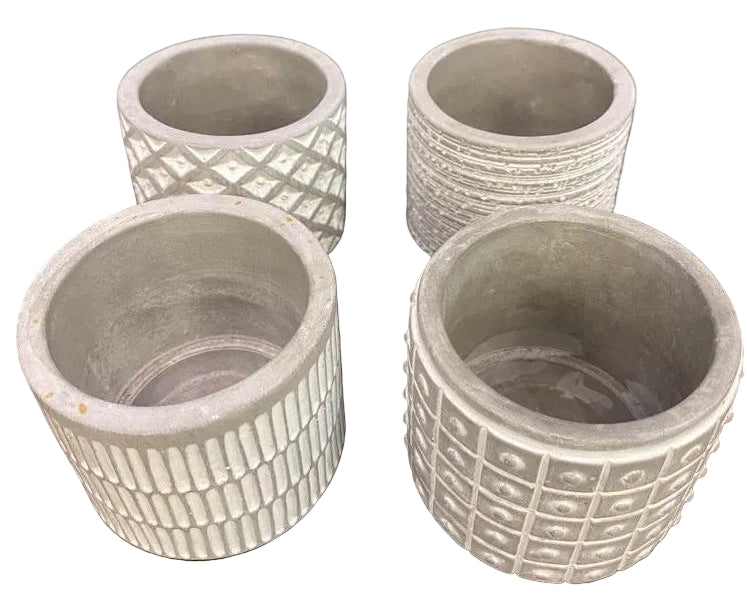 4 ceramic pots with geometric patterns.