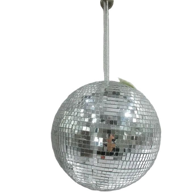Silver disco ball hanging against a plain white wall