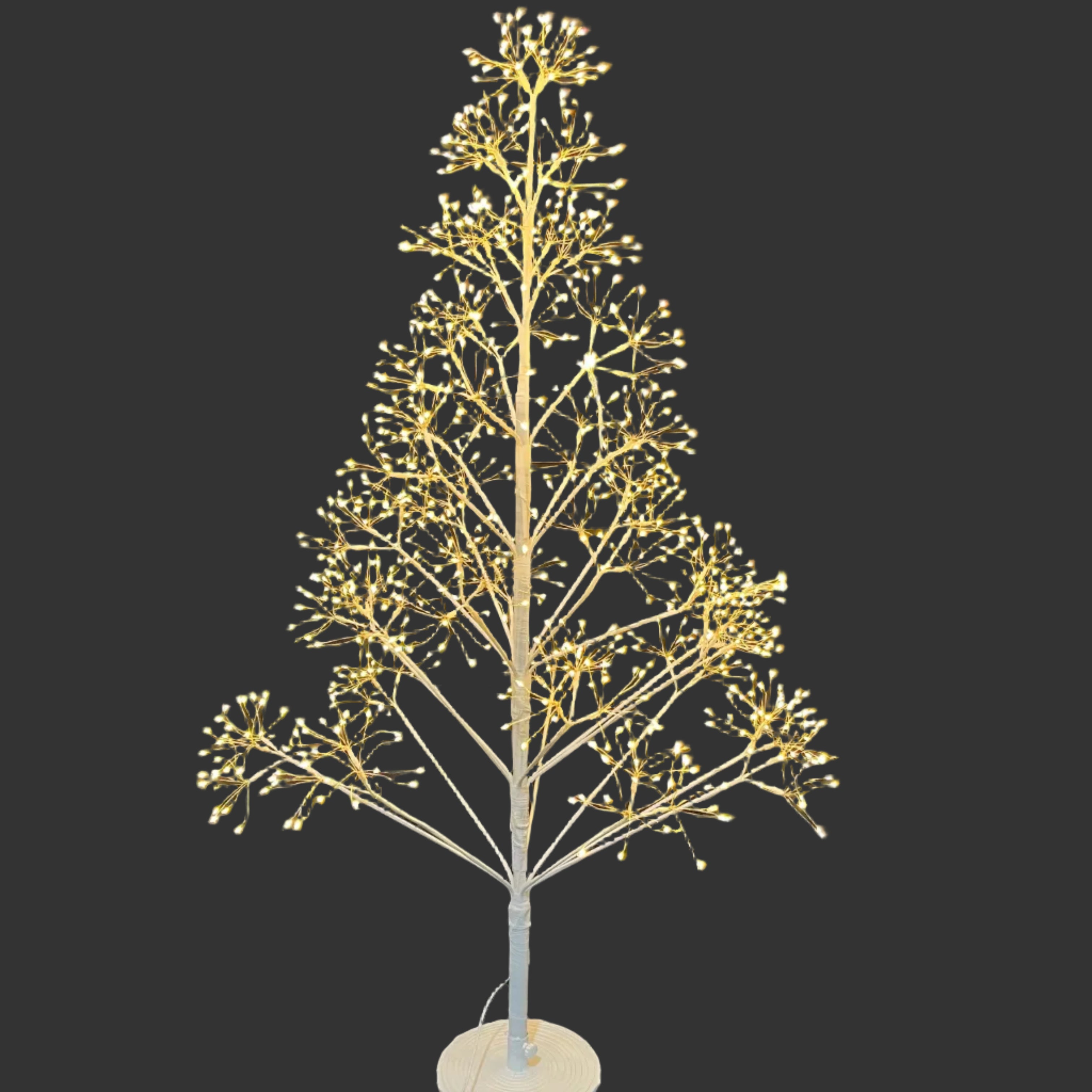 A white artificial tree with warm white LED lights