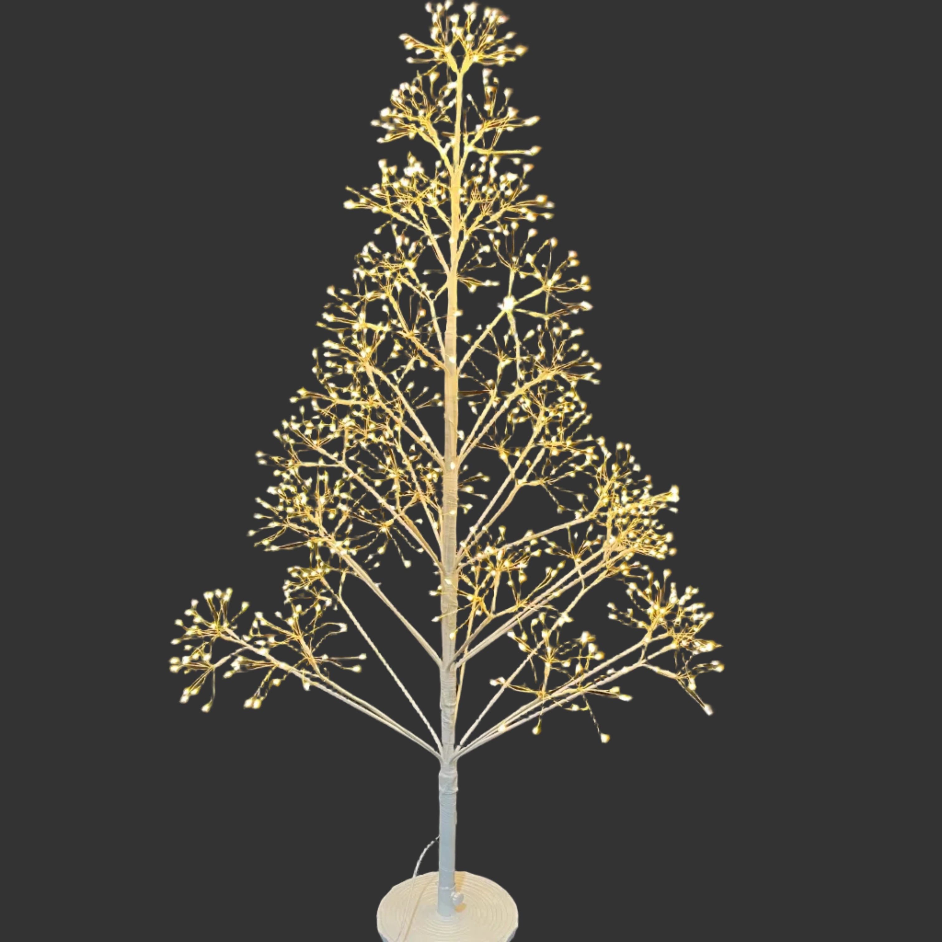 A white artificial tree with warm white LED lights 