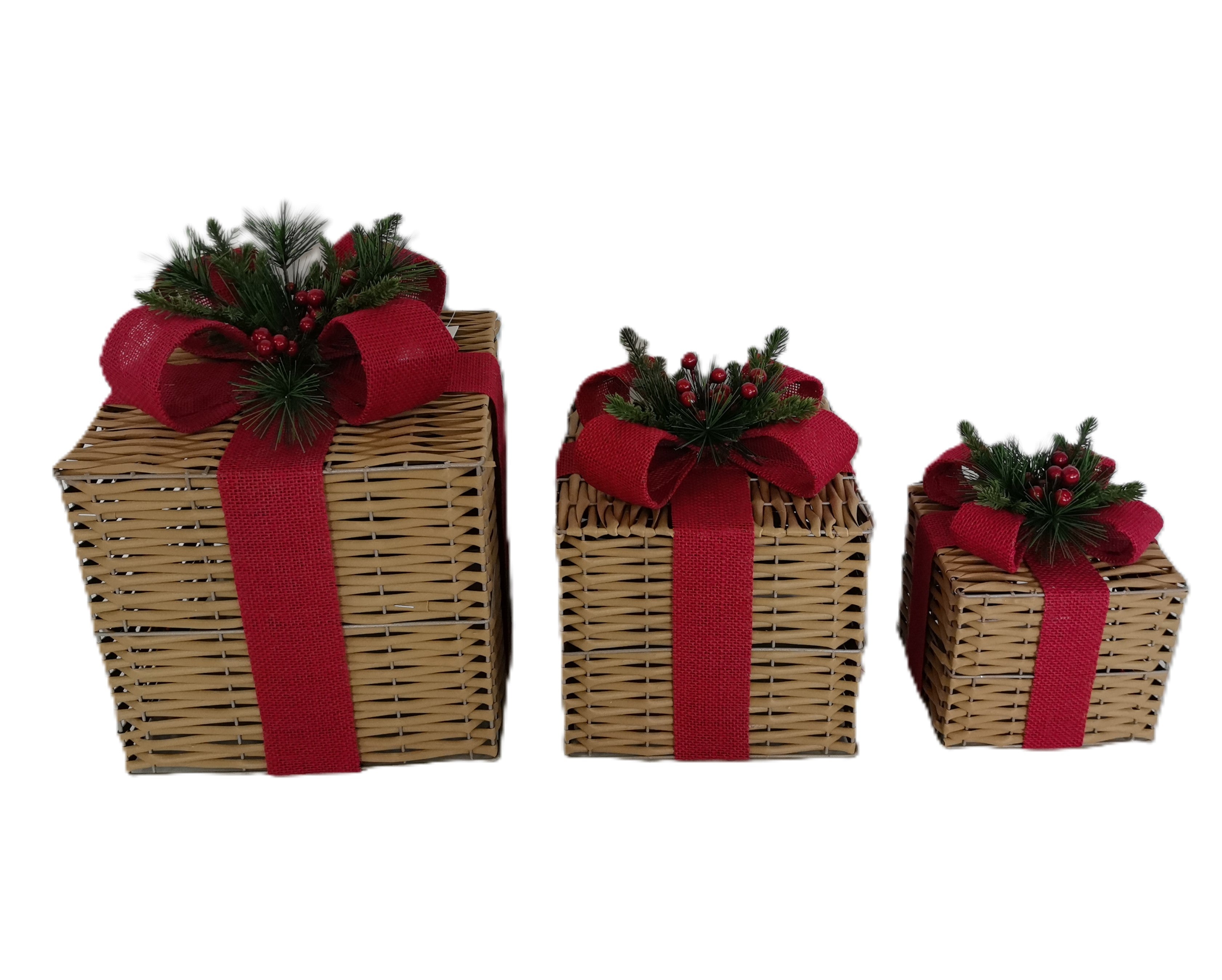 Three wicker gift boxes in different sizes, decorated with red ribbon, red hessian bows, and artificial pine sprigs with red berries.