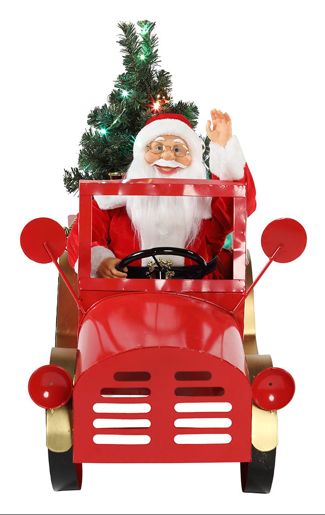 A 60cm tall figurine of Santa Claus sitting in a red toy truck with music and lights.