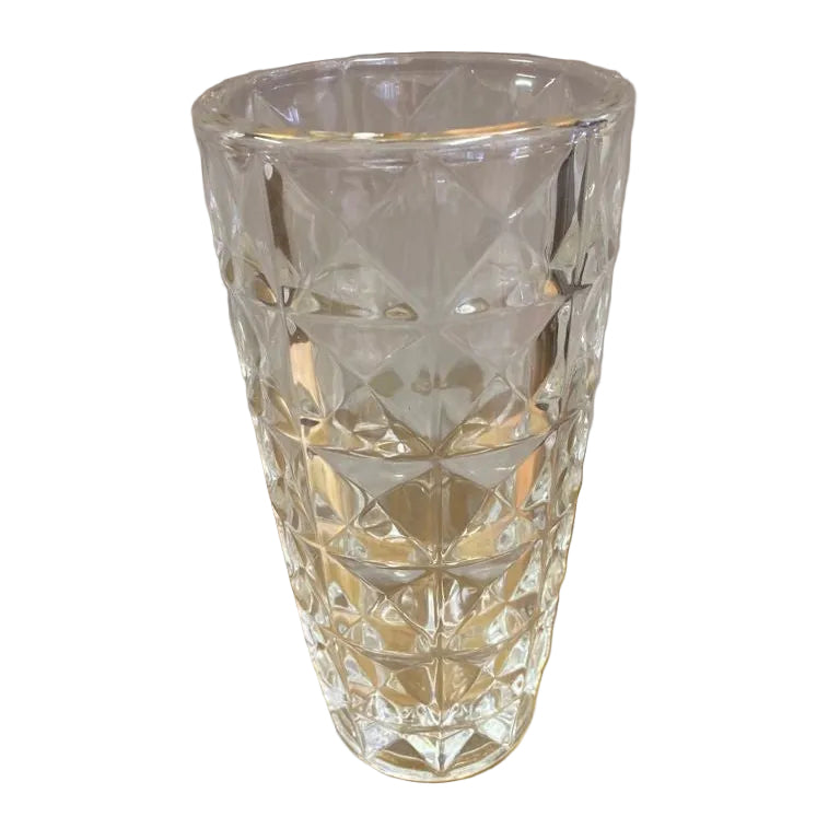 A clear glass vase with a geometric pattern