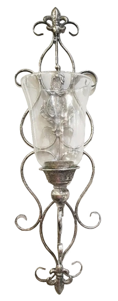 A silver metal wall lantern with a clear glass candle holder.