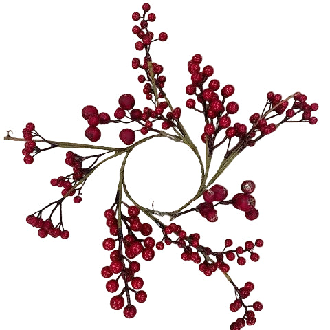 A decorative ring with red berry embellishments used as a candle holder.